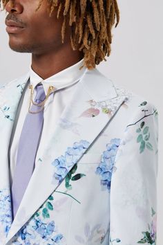 Bloomin' gorgeous. The Pickhurst blue suit jacket was designed to make sure you stand out in the crowd - we just knew you needed another floral suit to add to your collection. Cut from a lightweight cotton blend, it's the perfect piece to bring the sunshine all year-round for occasions here or abroad. Cut with a peak lapel, straight flap pockets & double darts. When paired with the matching skinny fit trousers this jacket makes a statement. Spring Formal Suit With Floral Print, Formal Floral Print Suits For Spring, Spring Floral Print Formal Suits, Formal Tailored Suits With Floral Print, Tailored Floral Print Suit For Formal Occasions, Tailored Floral Print Suits For Formal Occasions, Tailored Floral Print Suits For Formal Events, Tailored Floral Print Outerwear For Formal Occasions, Tailored Formal Blazer With Floral Print