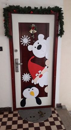 a door decorated with an image of a polar bear and penguin