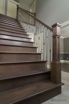 a set of wooden stairs leading up to a second story