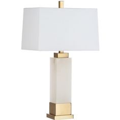 a white lamp with a gold base and a white shade on the top one side