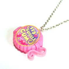 a pink gummy bear necklace on a chain