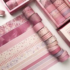 pink washi tapes are laid out on top of each other, with matching boxes in the background