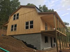 a house being built on the side of a hill