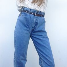 "Vintage Jeans by Armani - Jeans 1990 Denim trousers in blue color. Classic fit slightly tightened at the ankle. Button closure. Brand logo on the buttons, rivets and on the right back pocket . Labels at the back waistband (inside and outside) and on the side of the small front pocket. 5 pockets. 7 belt loops. In perfect condition. 100% cotton Estimted size 30 The model usually wears a size S (jeans W 27) Flat measurements:(1 inch = 2,54 cm) Waist: 38cm - 14,9\" Hips: 52cm - 20,4\" Length: 112cm 90s Style Light Wash Bottoms For Everyday, Classic Light Wash Denim Pants, 90s Style Tapered Leg Denim Jeans, 90s Style Bottoms With Straight Leg And Belt Loops, Retro Rigid Denim Bottoms For Everyday Wear, Retro Light Wash Jeans For Everyday, 90s Style Straight Leg Bottoms For Everyday, Vintage Blue Jeans For Everyday, 90s Style Denim Jeans For Everyday