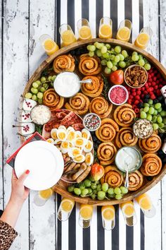 a platter filled with different types of food and drinks on top of a table