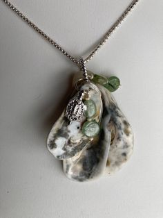 "Natural sea shell pendant necklace, ocean shells clustered with a Sterling Turtle ( plated ) charm and Kyanite charms on Sterling plated rings. Unique seashell pendant measures 2 1/4\" X 1 1/4''. Comes with a Sterling plated 20\" loop chain. Makes a great summer choker necklace.  Sterling silver necklace is not included, it was used as DISPLAY ONLY.  But it can be purchased for $52.50 and necklace 20'' and  is stamped 925 Italy. You can compare the size of the shells to the $0.50 cent piece in the pictures. All my necklaces are different and would be considered one of a kind. View my collection of Kingman Arizona Turquoise here: https://www.etsy.com/shop/MoonwaterJewelryShop?section_id=28192591  I've been selling on eBay since 2003 Came to Etsy to sell jewelry. Returns and exchange detail Summer Choker, Seashell Pendants, Seashell Earrings, Stone Engraving, Gemstone Beads Jewelry, Chain Loop, Turtle Charm, Seashell Jewelry, Shell Jewelry