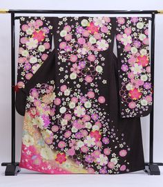 Cover yourself in flowers wearing this traditional Japanese silk Furisode kimono in black.    Made of high quality silk threads.  Beautiful on or as a room display too. Item: Furisode Silk Kimono No. frs177 Size: US  L   /  Length 64.5 inch (164cm), Width 27 inch (69cm). Design :  Floral Condition: Used, Very Good. Please check the photos. Need a Obi sash to wear this kimono? Find it here: https://www.etsy.com/shop/KimonoFujiyamarock?ref=simple-shop-header-name&listing_id=1418707729&section_id=1 Traditional Black Kimono For Tea Ceremony, Kimono Mom, Traditional Black Kimono With Floral Print, Traditional Black Floral Print Kimono, Kimono Girl, Obi Sash, Furisode Kimono, Wedding Kimono, Black Kimono