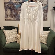 This Is A Listing Created For A Posh Show. Join A Posh Show To Learn More! Flowy Long Sleeve Dress With Tassels, White Long Sleeve Midi Dress For Beach, White Vacation Dress With Tassel Ties, Casual White Dress With Tassel Ties, Long Sleeve Dresses With Tassels For Vacation, White Midi Beach Dress With Long Sleeves, Flowy Vacation Dress With Tassels, Casual White Dresses With Tassel Ties, Spring Day Out Dress With Tassels