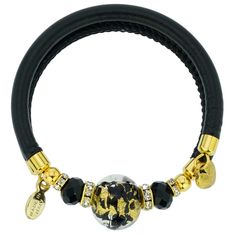 Adorn your wrist with this lovely Murano Glass bracelet - a fine token of Venice with its glamour, elegance, and charm. A high-quality textured black leather band complements a stunning 24K gold-lined finely crafted Murano Glass bead in the center. This Venetian bracelet is handmade in a small Murano Glass workshop in Venice, Italy by experienced artisans who use only basic tools to shape glass beads under a small flame, as was the Venetian custom for a thousand years. This radiant Murano bracel Adjustable Gold Leather Chic Bracelet, Adjustable Gold Leather Bracelet Chic Style, Elegant Leather Bracelet For Party, Chic Gold Jewelry With Leather Strap, Elegant Gold Bracelet With Interchangeable Details, Elegant Gold Interchangeable Bracelet, Luxury Gold Leather Bracelet Adjustable, Luxury Gold Leather Bracelet With Adjustable Fit, Luxury Gold Adjustable Leather Bracelet