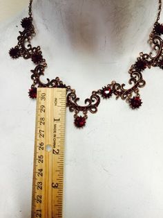 Plated in antique copper with Siam crystals. Love this color combo!! Vintage Red Copper Jewelry, Red Vintage Copper Jewelry, Victorian Bronze Copper Necklace, Handmade Victorian Red Necklace, Vintage Red Ceremonial Necklace, Red Oval Victorian Necklace, Vintage Red Garnet Necklace, Victorian Garnet Necklace, Antique Copper