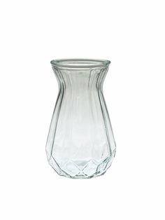 a clear glass vase sitting on top of a white table