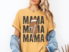 Football Mama Comfort Colors® Shirt, Football Season Football Tee, Trendy football Mama girly tee, Gift for Football Mom, Sports Mama Tee Comfort Colors  ⭐︎PRODUCT FEATURES⭐︎ ✧Direct to Garment - Ink is printed directly into the fabric, preventing any cracking or peeling! ✧Vintage Feel - Lived-in, faded feel and look; trendy colors ✧100% Ring-spun cotton - for a super soft tee ✧Preshrunk, soft-washed, garment-dyed fabric ✧Fade Resistant ✧Double-needle stitched sleeves and bottom hem ⭐︎WASHING INSTRUCTIONS⭐︎ ✧Machine wash on cold, inside out, on a gentle cycle. ✧Tumble dry on low or let air dry ✧Avoid using bleach or fabric softener ✧Do not dry clean ✧Avoid ironing directly on the design ⭐︎SIZING and COLOR⭐︎ ✧Please refer to the size chart in the photo section for shirt measurements before Graphic Tee With Sublimation Print For Football Season, Sporty Tops With Heat Transfer Vinyl For Fans, Football Season Team Spirit T-shirt, Football Tee, Mama Tee, Shirt Football, Football Tees, Comfort Colors Shirt, Football Mom