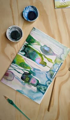 A brightly colored watercolour abstract on a table Trending Watercolor Art, Watercolour Workshop Ideas, Modern Watercolour Painting, Big Watercolour Painting, Abstract Watercolour Painting Ideas, Watercolour Abstract Art Inspiration, Black Watercolor Art, Watercolor Abstract Art For Beginners, Watercolours Painting Ideas