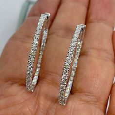 $2100 -$300 12/7/2023 Stunning Diamond Hoop Earrings White Gold.  There's diamonds set on the outside and Inside of the hoop.  Simple and Stylish earrings to wear on any occasion.  Excellent craftsmanship, the diamonds are very sparkling.  The lock on these earrings are very secure and easy to take on and off.  You need to push down on the lever to release the earrings, so it's not easy to lose these earrings.  The oval shape looks flattering on.  Nice size hoops, not too big or small.  Measures about 35.9 x 29.3mm.  About 2.1mm width.  Special price one pair only.   Genuine Round Brilliant Cut Diamonds  Total weight: 2.01 carats All white and shiny Diamonds  Clarity: SI  Color: G/H/I All 68 sparkling diamonds, no cloudy stones  Solid 14K White Gold 7.9 grams  Comes with gift box * We have Luxury Oval Diamond White Hoop Earrings, Diamond White Oval Hoop Earrings With Prong Setting, Oval Diamond White Hoop Earrings Fine Jewelry, Luxury Oval Hoop Earrings With Diamond Accents, Oval Hoop Earrings In Diamond White With Brilliant Cut, Oval Diamond Hoop Earrings In White Gold, White Gold Diamond Hoop Earrings With Oval Shape, White Gold Oval Diamond Hoop Earrings, Oval Cubic Zirconia Hoop Earrings With Halo Design