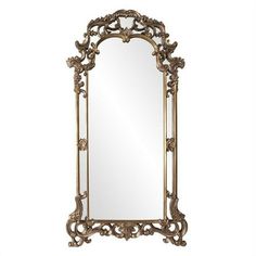 an ornate gold framed mirror on a white background