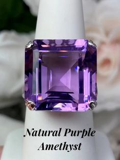 This is a beautiful vintage reproduction ring. The sterling silver filigree holds an ~20 carat natural or simulated purple amethyst gemstone. The amethyst stone has perfect purple grape color and amazing clarity. The flawless high-quality square-cut gemstone is 18mm square. The stone and setting rise about 1/2" off the finger. The inside of the band is marked 925 for sterling silver. Luxury Classic Amethyst Ring With Vs Clarity, Luxury Classic Hallmarked Amethyst Ring, Classic Octagon Amethyst Ring As Gift, Classic Octagon Amethyst Ring As A Gift, Classic Octagon Amethyst Ring For Gift, Classic Amethyst Ring For Gift, Elegant Amethyst Wedding Ring With Vs Clarity, Classic Formal Amethyst Ring, Formal Emerald-cut Solitaire Amethyst Ring