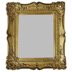 an ornate gold framed mirror against a white background