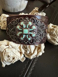 holiday shopping is upon us shop early My cut off date for making/processing orders for approximate Christmas delivery is December 12  Have a blessed New Year 🎉 Country leather bracelet cuff, western jewelry  Embossed distressed genuine brown leather 1 1/2" strap has been adorned with a copper flower with turquoise color inlay concho and sets on a detailed antiqued copper filigree. It is attached to the leather with two antiqued copper rivets. One antiqued copper snap has been placed to fit up Southwestern Style Brown Concho Bracelets, Rustic Brown Bracelet With Concho, Rustic Brown Concho Bracelets, Brown Bohemian Leather Bracelet With Concho, Southwestern Hand-tooled Brown Bracelets, Adjustable Western Cuff Bracelet With Patina, Rustic Brown Cuff Bracelet With Concho, Brown Rustic Jewelry With Patina, Southwestern Hand Tooled Brown Cuff Bracelet