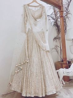 <ul>
<li style="text-align: justify;"><span data-preserver-spaces="true">Let your elegance reflect and get compliments with this beauty. This white lehenga is made of georgette material beautified with sequins work, and thread embroidered.</span></li>
<li style="text-align: justify;"><span data-preserver-spaces="true">This lehenga comes with a similar color georgette material blouse designed with sequins work, and thread embroidery, and a similar color n White Lehenga Choli, Sequence Lehenga, Gold Lehenga, Ghaghra Choli, Lehenga Choli For Women, Paper Border, Choli For Women, White Lehenga, Sabyasachi Lehenga