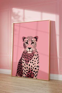 a pink room with a framed painting of a cheetah in front of it