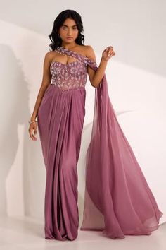 Mauve padded saree gown embellished by crystal and bead floral vine motifs on bodice and pleated waist. Comes with bead-crystal embellished detachable drape. - Aza Fashions Corset Saree, Gown With Drape, Lilac Saree, Embellished Corset, Saree Gowns, Structured Corset, Purple Saree, Saree Gown, Vacuum Storage