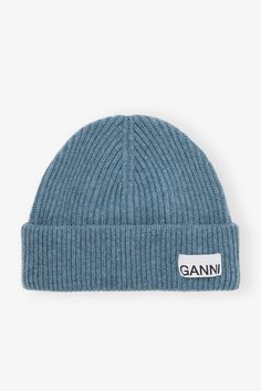 This Blue Fitted Rib Knit Wool Beanie features a folded cuff with a sewn-on GANNI logo patch. GANNI Blue Fitted Rib Knit Wool Beanie in Dusty Blue | Women's Knitted Wool Beanie, Denim Suit, Decorative Bows, Wool Beanie, New Arrival Dress, Dusty Blue, Cotton Poplin, Patch Logo, Round Neckline