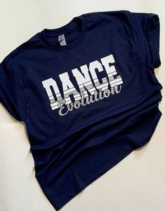 Custom Dance Team Shirt with name on back. This design can be customized for any sport or team. Order one for yourself or give you team a cohesive look with matching Custom Team Shirts! Shirts can be customized with this design using you team name and colors. Sport name can be done in glitter or smooth vinyl. Give me all the details in the  personalization box and we'll customize a shirt for you! After ordering i will make a mock up with your teams name, sport and colors for your approval. After  the design has been approved we will move on to production. Shirts are usually completed and shipped within a week, depending on how many are ordered. Shirts are 100% cotton. Design is made of heat transfer vinyl adhered to shirt using professional grade heat press. Dance Team Shirts Ideas High Schools, Fitted Short Sleeve T-shirt For Cheerleading, Fitted Team Spirit T-shirt With Custom Print, Fitted Custom Print Team Spirit T-shirt, Fitted Custom Print T-shirt For Team Spirit, Fitted T-shirt With Custom Team Spirit Print, Fitted Short Sleeve T-shirt For Team Events, Cotton Tops With Name Print For Team Events, Custom Print Cotton Tops For Team Events