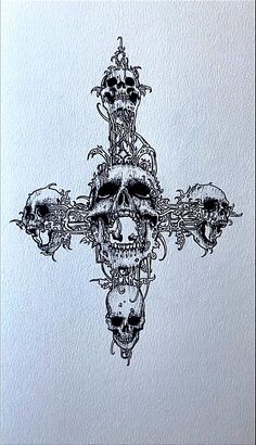 a cross made out of skulls on top of a white paper with an arrow in the middle