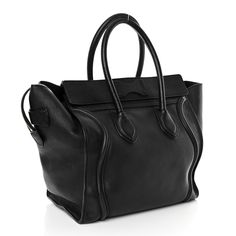 This is an authentic CELINE Smooth Calfskin Mini Luggage in Black. This stylish tote is crafted of luxuriously smooth calfskin leather in black. It features rolled leather top handles with a signature Celine scroll trim and expansive sides. The overextended zipper opens to a spacious leather interior with zipper and patch pockets. Luggage Black, Mini Luggage, Celine Luggage Bag, Leather Interior, Leather Top, Tri Color, Belt Bag, Patch Pocket, Bucket Bag