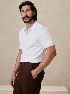 This classic polo is cut from our Luxury-Touch cotton jersey—beloved for its signature softness and a smooth finish that leans more dressed-up in appearance.  Polo collar.  Button placket.  Straight hem with vented sides.  Standard fit.  Short sleeves.  Hits at the hip.  Model: Size M, 6'2" (188cm). Inspired Fashion, Fashion Lookbook, Polo Collar, Curator Style, Button Placket, Black And Navy, Banana Republic, Mens Polo, Vintage Inspired