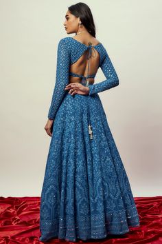 This look features a cobalt blue lehenga set. The floral lehenga is intricately embellished with thread and sequins all over. It is teamed with a matching, full sleeved choli . A net dupatta with zari and sequin border & buttis complete the look. Cancan & pockets are included. Stitched blouse with deep V neck type. Lehenga comes with can can and blouse with padding. Composition / Material: Viscose georgette lehenga and blouse with soft net dupatta in Rust color. Delivery: This piece will take 2- Full Sleeves Blouse Designs, Choli Blouse Design, Full Sleeves Design, Full Sleeve Blouse, Floral Lehenga, Backless Blouse Designs, Lehenga Designs Simple