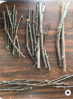 several branches are arranged on a cutting board and ready to be cut into smaller pieces