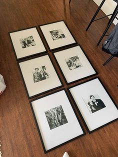 four black and white photos are on the floor in front of a dining room table