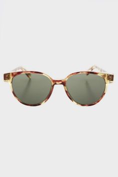 First made famous in the 1950s this sunglass is now a classic. The round lens fits in a sleek frame with a high hinge. Made of quality acetate plastic with double studs on the frame ends. u00a0 u00a0 u00a0 u00a0 u00a0u00a0 RX Optical Quality SIZE 48mm Eye Size 20mm Bridge 150mm Temple/Arm 5 1/2" Width 1 7/8" Height | Sunglass Museum Vintage Jackson Horn Rim Sunglasses in Blonde Tortoise, Women's at Urban Outfitters Double Stud, The 1950s, Tortoise, Horn, Vintage Shops, Urban Outfitters, Temple, Bridge, Blonde