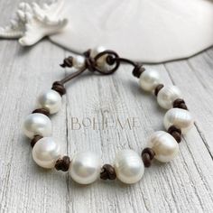 What a great gift idea for a loved one or maybe a little something for yourself. Genuine freshwater white pearls on leather bracelet. Nine beautiful medium pearls are centered on brown leather cord and is customized comfortably to your wrist. Looks great worn alone or showcased with other layering jewelry. Your jewelry is individually hand crafted just for you and ships quickly from Florida.  If you would like a custom piece, please feel free to message me :) For more bohemian jewelry: www.etsy. Elegant Leather Beaded Bracelets As Gift, Handmade Pearl White Everyday Pearl Bracelet, Everyday White Pearl Drop Bracelets, Elegant Beaded Leather Bracelet, Elegant Leather Beaded Bracelets, Leather Round Beads Jewelry For Gift, Elegant Beaded Leather Bracelets, Elegant Beaded Leather Bracelet Gift, Elegant White Leather Jewelry