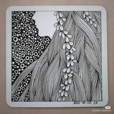 a black and white drawing with flowers on it