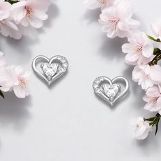 Elevate your style with our 925 Sterling Silver Heart Earrings featuring dazzling CZ diamonds. A blend of timeless charm and modern elegance! Width: 5⁄16 inches Height: 9⁄32 inches Elegant Silver Heart Earrings For Mother's Day, Elegant Cubic Zirconia Earrings For Mother's Day, Sterling Silver Double Heart Earrings, Sterling Silver Heart Cut Earrings For Wedding, Elegant Heart Earrings As Gift For Her, Elegant Heart Earrings For Her, Elegant Round Heart Earrings For Mother's Day, Elegant Heart Earrings For Mother's Day, Mother's Day Heart Earrings In Cubic Zirconia