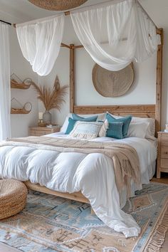 a bed with white sheets and blue pillows