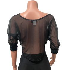 Loose-fitting cropped dolman-style top in black mesh sheer spandex. 3/4 sleeves with bands at the ends. Back of top is slightly longer than the front. Perfect matching top for leggings or joggers. Stretch Mesh Top With Built-in Bra For Night Out, Black Mesh Cropped Top, Stretch Crop Top With Mesh Sleeves For Summer, Summer Stretch Crop Top With Mesh Sleeves, Fishnet Mesh Crop Top For Night Out, Black Mesh Top With Mesh Sleeves For Club, Black Cropped Mesh Top With Mesh Sleeves, Night Out Mesh Top With Built-in Bra, Mesh Top With Built-in Bra For Night Out