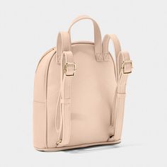 The Cleo Backpack is the perfect companion for travel or daily use. Its compact size and high quality vegan leather make it both stylish and practical. The soft nude pink color adds a touch of elegance to any outfit. Stay organized and look great with the Cleo Backpack! Dimensions: 10 5/8" x 8 11/16" x 3 3/4" By Katie Loxton London Cleo Backpack By Katie Loxton Chic Everyday Backpack With Adjustable Strap, Trendy Leather Backpack With Adjustable Straps For On-the-go, Chic Pink Backpack With Adjustable Strap, Blush Bag With Zipper For Everyday Use, Blush Bag With Zipper For Daily Use, Everyday Blush Bag With Adjustable Strap, Blush Travel Bag With Adjustable Strap, Versatile Everyday Blush Bag, Beige Leather Backpack With Zipper For On-the-go