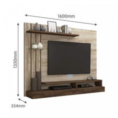 the wall mounted entertainment center is shown with shelves and shelving unit for tvs