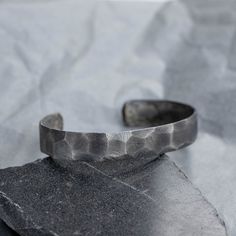 "Handmade cuff bracelet for men in oxidized sterling silver. A wide unisex bangle bracelet in oxidized sterling silver in a unique handmade brutalist design. A great choice as a birthday gift for him. 100% handcrafted with love! DETAILS * Metal: High-quality Sterling Silver 925 * Finish: Oxidized Silver * Width: 12mm * Length: 16.5cm * Oval Dimensions: 6.5cm x 5cm 100% nickel free Delivered in an elegant gift package! SHIPPING All orders are shipped via FedEx Express for speed and security (deli Modern Cuff Bracelet With Oxidized Finish As Gift, Modern Oxidized Finish Cuff Bracelet As A Gift, Minimalist Oxidized Finish Bracelets As Gift, Minimalist Oxidized Finish Bracelets For Gift, Minimalist Bracelets With Oxidized Finish As Gift, Modern Oxidized Finish Cuff Bracelet, Unique Cuff Bracelet With Oxidized Finish As Gift, Unique Oxidized Finish Cuff Bracelet For Gift, Unique Oxidized Finish Cuff Bracelet As Gift