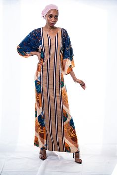 DESIGNER'S NOTE: Cotton Kaftan Maxi Dress. Envelope yourself in comfortable elegance wearing this floor-skimming kaftan that artfully fuses 3 different fabrics to stunning effect. The mixed print cotton used for the kaftan is beautifully complemented by dramatic lace sleeves and the striped brown and navy striped cotton used in the middle. Designed to flatter your curves. Comfy chic. And it has pockets!CUSTOM MADE: Designed especially for you to ensure a perfect fit according to your height and Multicolor V-neck Kaftan With Batik Print, Multicolor Printed Maxi Kaftan, Multicolor Maxi Kaftan With Printed Motifs, Batik Print Maxi Length Kaftan, Multicolor Long Sleeve Block Print Kaftan, Multicolor Block Print Kaftan With Kimono Sleeves, Bohemian Cotton Maxi Dress With Vibrant Print, Long Multicolor Kaftan With Batik Print, Long Multicolor Batik Print Kaftan