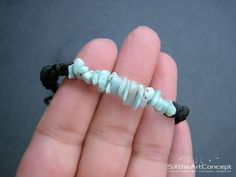 "Larimar bracelet, a unisex braided stacking wristband with healing gemstone and the stone of love, this would make a perfect gift for him or her, or a great gift for yourself. The bracelet is hand braided on 2mm black satin cord with adjustable knot finish. Due to the adjustable sliding knot finish, it can fit perfect to everyone. Check below the dimensions and cord length. If you want any other size bracelet please contact me. The listing is for one bracelet similar to the bracelet shown in ph Spiritual Blue Hand-wrapped Bracelets, Spiritual Blue Hand-strung Bracelets, Green Hand-strung Bracelet For Meditation, Spiritual Silver Hand-strung Braided Bracelets, Braid Cuffs, Spiritual Turquoise Braided Hand-strung Bracelets, Larimar Bracelet, Green Tissue Paper, Adjustable Knot