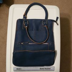 This Beautiful Blue Mark Purse From Avon Is Just Right For Your Purse Needs. It Is New And Never Used, However, I No Longer Have The Original Tags. It Has A Deep Inside Space With An Inside Zip Pocket. There Is An Outside Zip Pocket, As Well As A Side Pocket ( Last Picture) For Easy Access. This Is An Awesome Purse For Work, Or A Dressy Affair. Avon Bags, Avon Timeless Perfume, Avon Mark, Avon Clearskin, Bow Purse, Silver Handbag, Avon Anew Skincare, Avon Anew Ultimate, Red Tote Bag