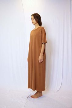 About product    garment dye half sleeve t-shirt maxi dress - this dress features a relaxed t-shirt style with half sleeves a side pocket offering a comfortable and casual look.  crafted from high-quality fabric and garment-dyed to perfection each dress has a unique and slightly lived-in appearance giving it a touch of character and charm.  the soft and breathable material ensures all-day comfort making it ideal for everyday wear.  the maxi length adds a touch of elegance to this laid-back style making it suitable for a variety of occasions.  dress it up with statement accessories and sandals for a bohemian-inspired look or keep it relaxed with sneakers and a denim jacket for a casual day out.  whether you're heading to the beach or meeting up with friends this dress will be your go-to cho Shirt Maxi Dress, Relaxed Dress, Cotton Jersey Dress, Maxi Shirt Dress, Sustainable Style, T Shirt Style, Beauty Wellness, Laid Back Style, Wellness Products