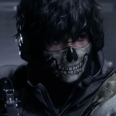 a man with black hair and skull makeup