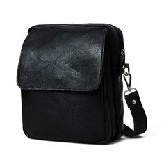 The Enzo black leather messenger bag for men is a versatile and stylish accessory designed to carry essentials in a convenient and fashionable manner. Crafted from high-quality, durable leather, it exudes a sleek, professional appearance. The bag typically features an adjustable shoulder strap for comfortable carrying, and multiple compartments and pockets for organized storage. Its spacious interior can accommodate documents, phones and personal items. The classic black color complements variou Classic Black Satchel For Everyday, Classic Black Shoulder Bag For Everyday, Black Leather Laptop Bag For Everyday Carry, Black Leather Laptop Bag For Everyday, Black Leather Messenger Bag, Messenger Bag For Men, Organized Storage, Professional Appearance, Color Complement