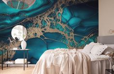 a bed room with a neatly made bed and a large wall mural on the wall