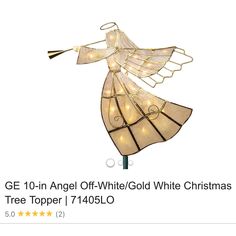 a white christmas tree topper with angel lights on it's wings and the words g